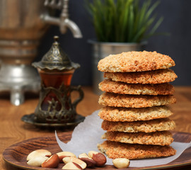 Oatmeal Cookies with nuts and tea at Samovar on a wooden table