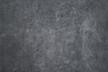 Texture of dark gray concrete wall as an abstract background