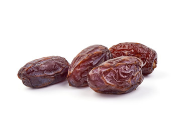 Sweet Medjool dry dates, close-up, isolated on white background
