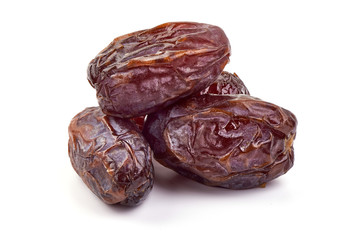 Fresh Medjool dry Dates, close-up, isolated on white background