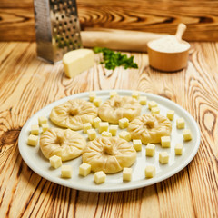 Georgian dumplings Khinkali with cheese, greens and tomato spicy sauce Satsebeli on white plate