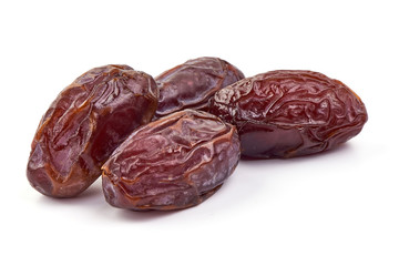 Sweet Medjool dry dates, close-up, isolated on white background