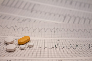 Small drugs for legal use on strips of electrocardiograms.