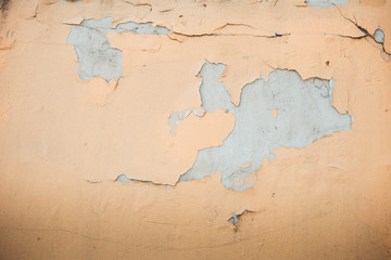 background of wall with peeled paint beige