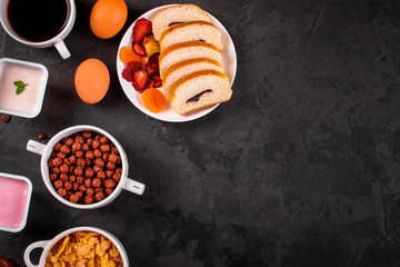 breakfas - cornflakes, coffee, jam, other ingredients. Top view. Copy space