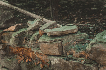 broken stone brick steps partially overgrown with grass