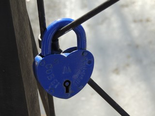 padlock and heart on dark background