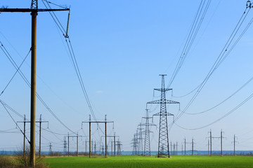 power line summer landscape / passing overhead electricity wire of the support carrying the light and the heat in the house