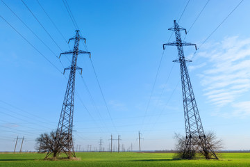 power line summer landscape / passing overhead electricity wire of the support carrying the light and the heat in the house
