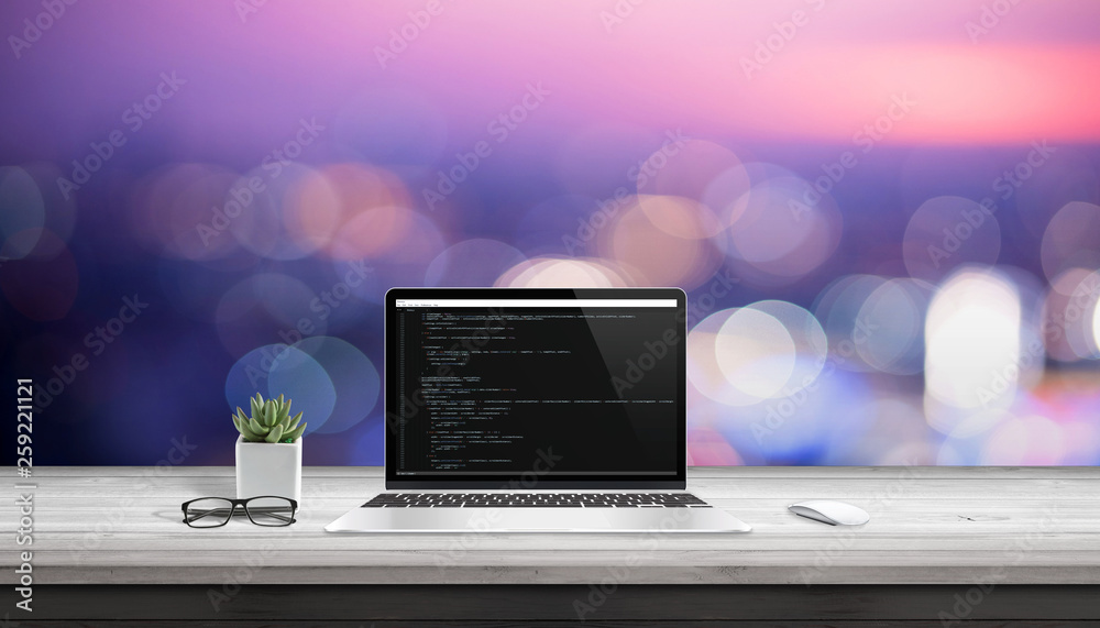 Poster App development on laptop computer with code editor on display.