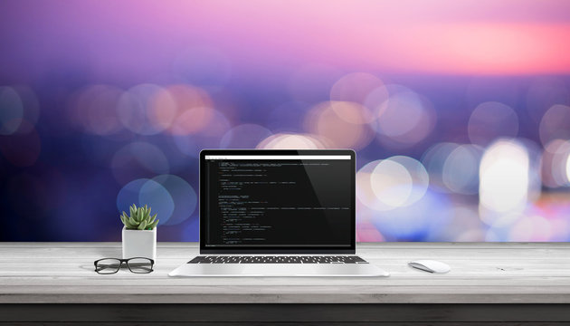 App development on laptop computer with code editor on display.