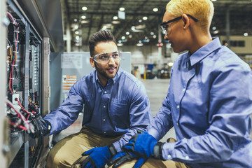 Service technicians inspecting equipment