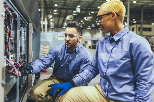 Service technicians inspecting equipment
