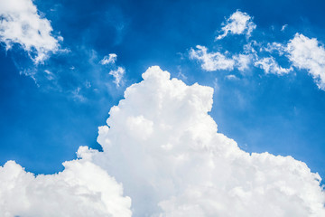 Naklejka na ściany i meble White Cloud in blue sky on a sunny day