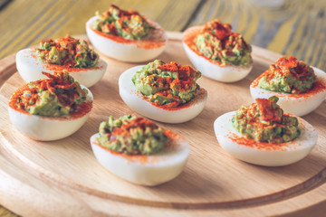 Guacamole and bacon deviled eggs