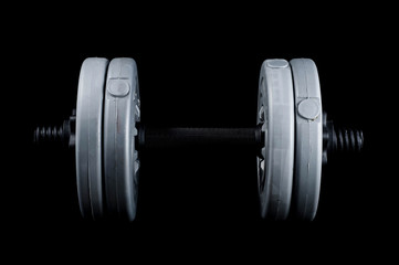 Preparing for the summer beach season with dumbbells