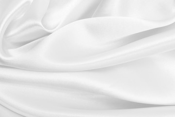 Smooth elegant white silk or satin luxury cloth texture as wedding background. Luxurious background design