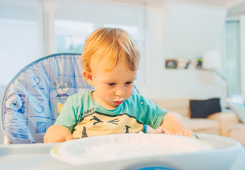 Cute, messy baby eating
