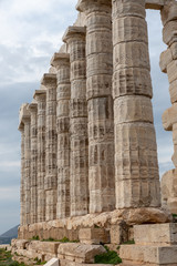 Greek temple vertical columns stone marble cliff portrait