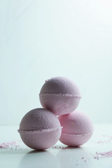 Natural homemade pink bombs for bath on white background. Natural cosmetics, SPA concept.