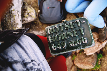 Tourists, travelers reached the mountain top of Rotset Hornet in Volda, Norway. The peak of high...