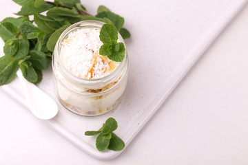 Coconut bisquit dessert with ricotta, mint. Yogurt breakfast