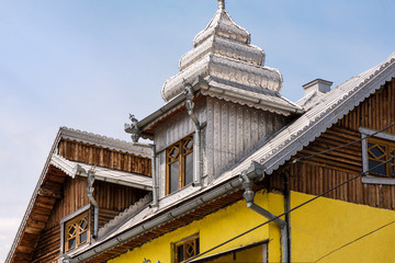 Traditional gypsy house with luxury decorations and ornaments on the roof in Huedin, Romania being...