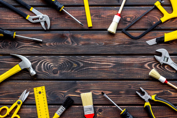 constructor desk with set of building implements and brushes wooden background top view mock up