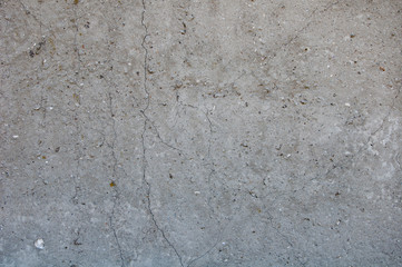Gray concrete texture background. Damage. Cracked stone wall background.