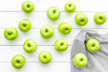 Obraz na płótnie Canvas summer food with apples on light wooden background top view pattern