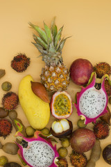 tropical fruits on an orange background