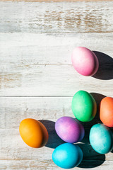 Bright And Colorful Easter Eggs On Weathered Wood