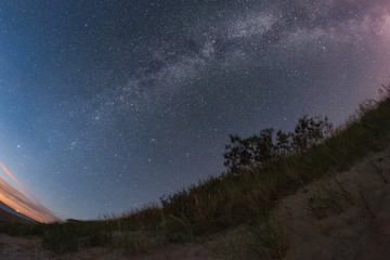 Milky Way over the Baltic sandy beach. Fisheye