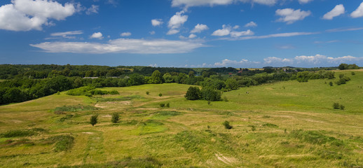 Fototapeta premium Green hill valley at warm summer day