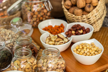 Various piles of mixed nuts and seeds
