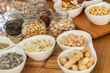 Various piles of mixed nuts and seeds