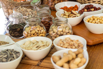 Various piles of mixed nuts and seeds