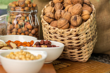 Various piles of mixed nuts and seeds