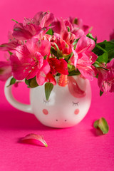 Unicorn mugs with Alstroemeria on bright pink background