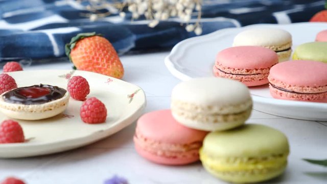 Colorful French macarons cakes desert set on party table.