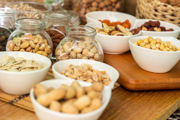 Various piles of mixed nuts and seeds