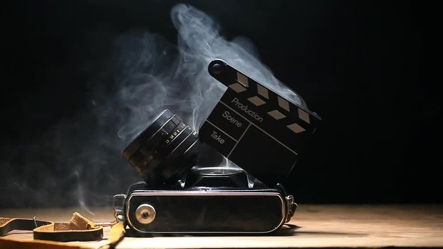 camera clapper board smoke dark background hd footage 