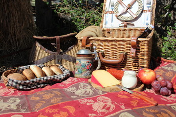 Autumn Picnic basket beside hay bale