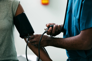 Exam: Woman Has Blood Pressure Tested