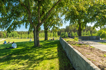 The wall with flowers on the crest of Almhöjden a memorial hill at Skogskyrkogården in Stockholm