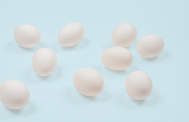 White egg. Raw eggs on pastel blue background.