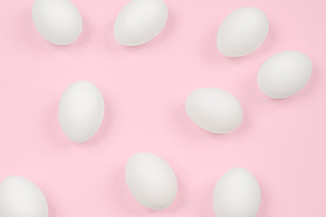 White egg. Raw eggs on pastel pink background.