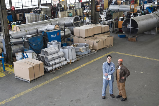 Portrait of male and female factory workers