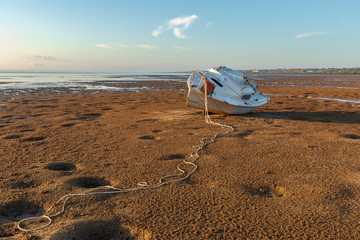 Fototapeta na wymiar Boat stranded on beach