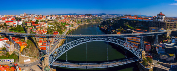 Porto Cityscape with Dom Luis I Bridge over Douro River and medieval Ribeira district at day time,...